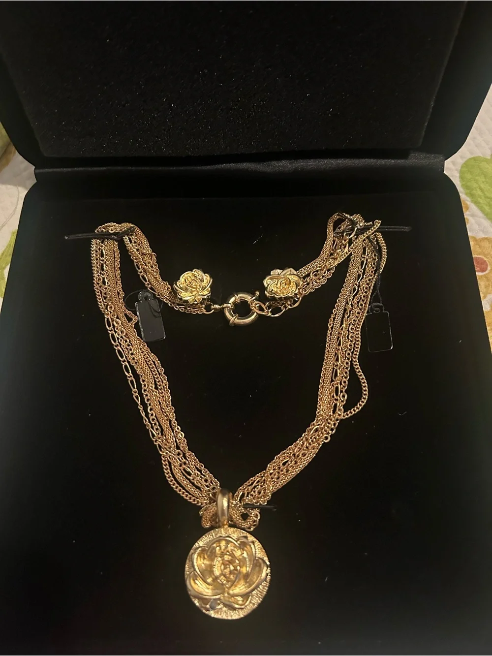 Gold-Tone Multi Strand Necklace with Floral Medallion & earrings